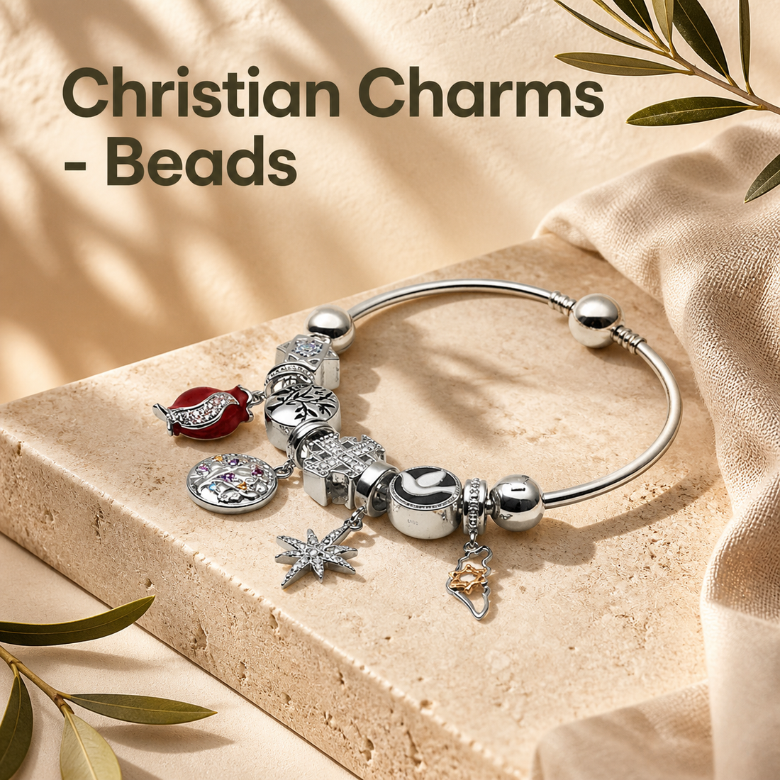 Christian charm bracelet with silver beads and religious charms displayed on travertine stone with warm natural light
